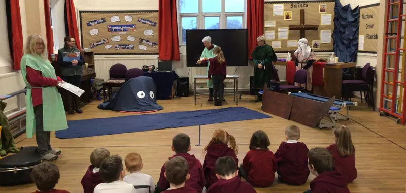 Children enjoying collective worship.