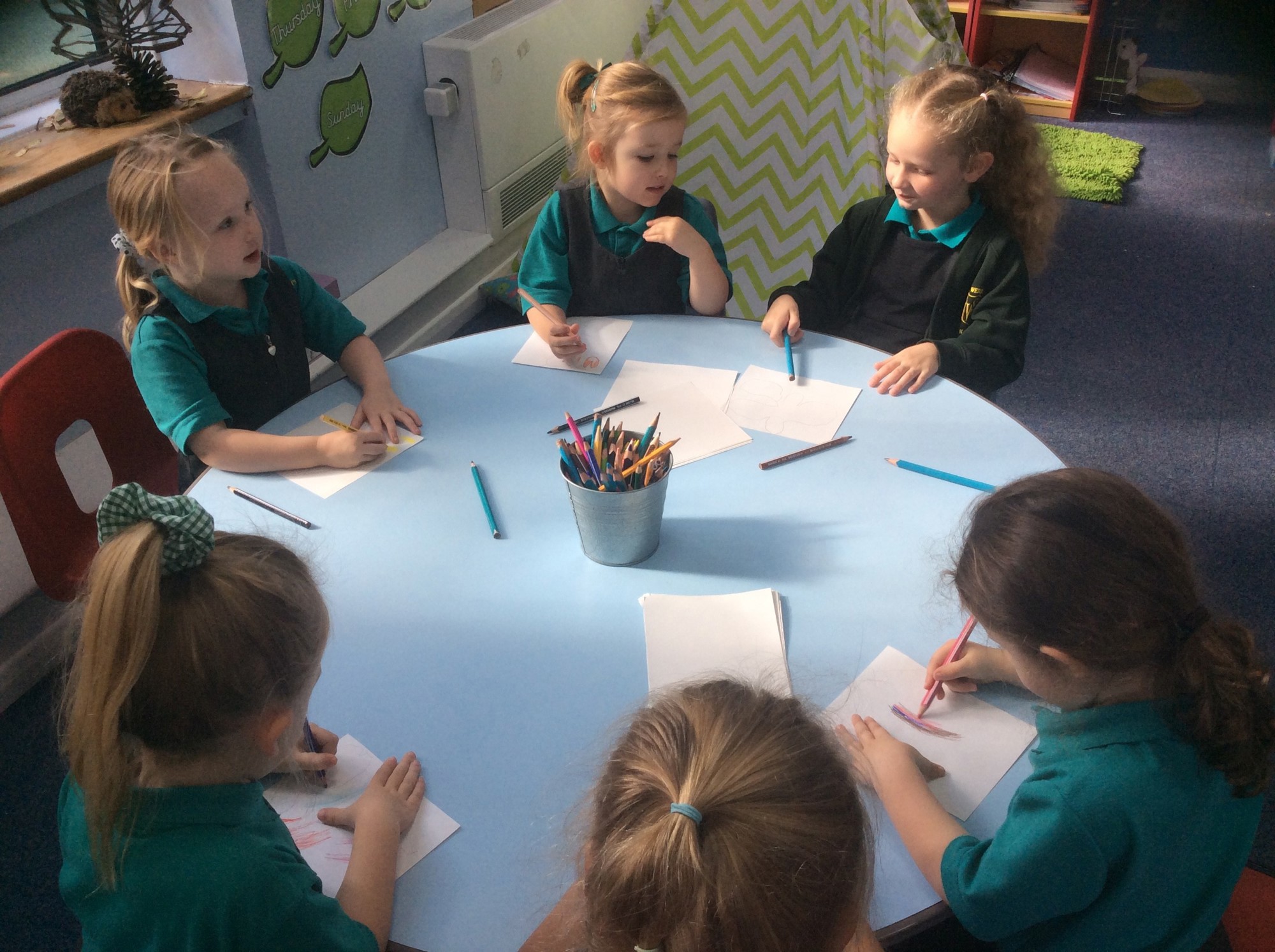 Six younger children starting to write.