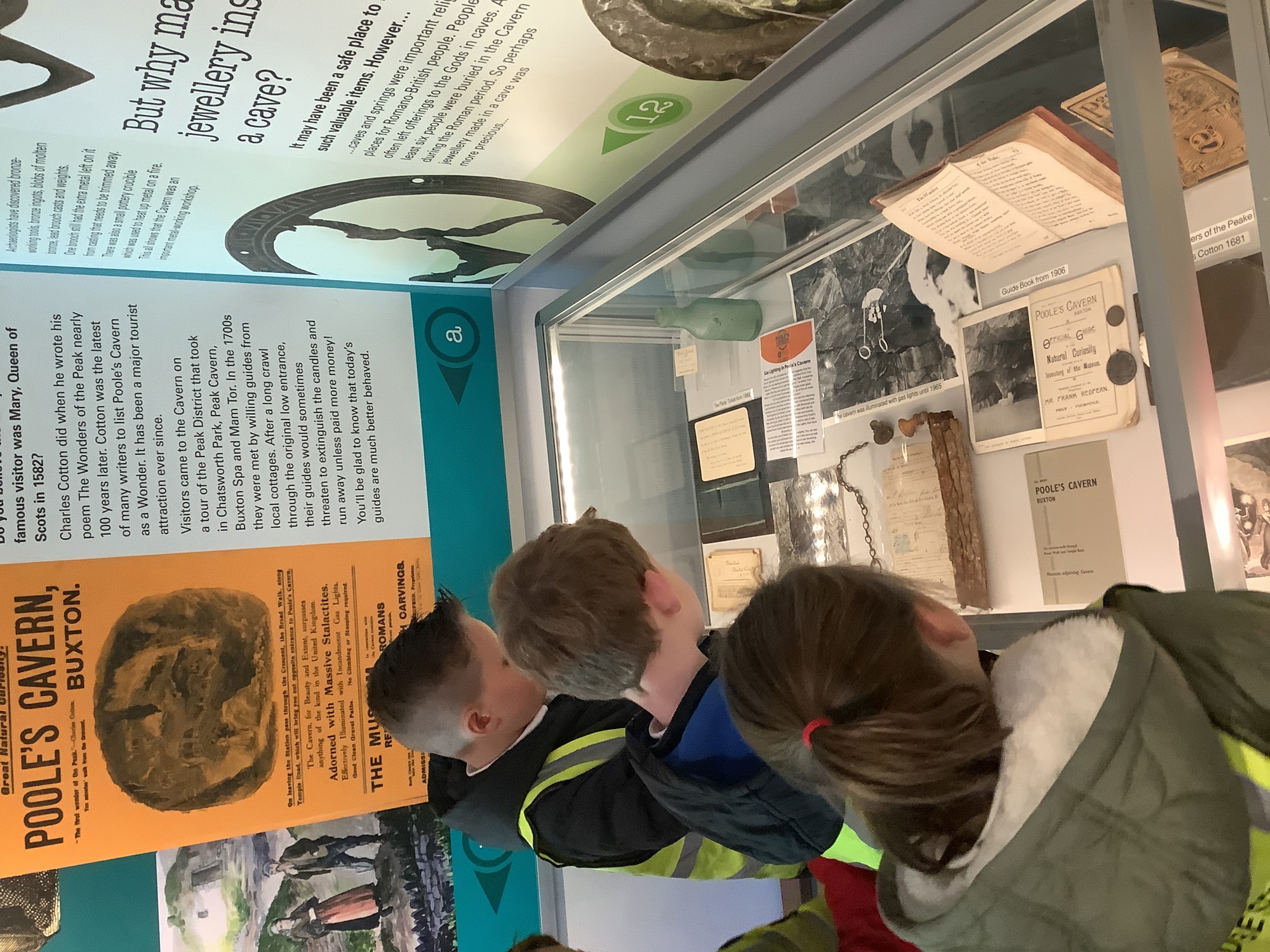 Children reading an artefact on an educational visit.