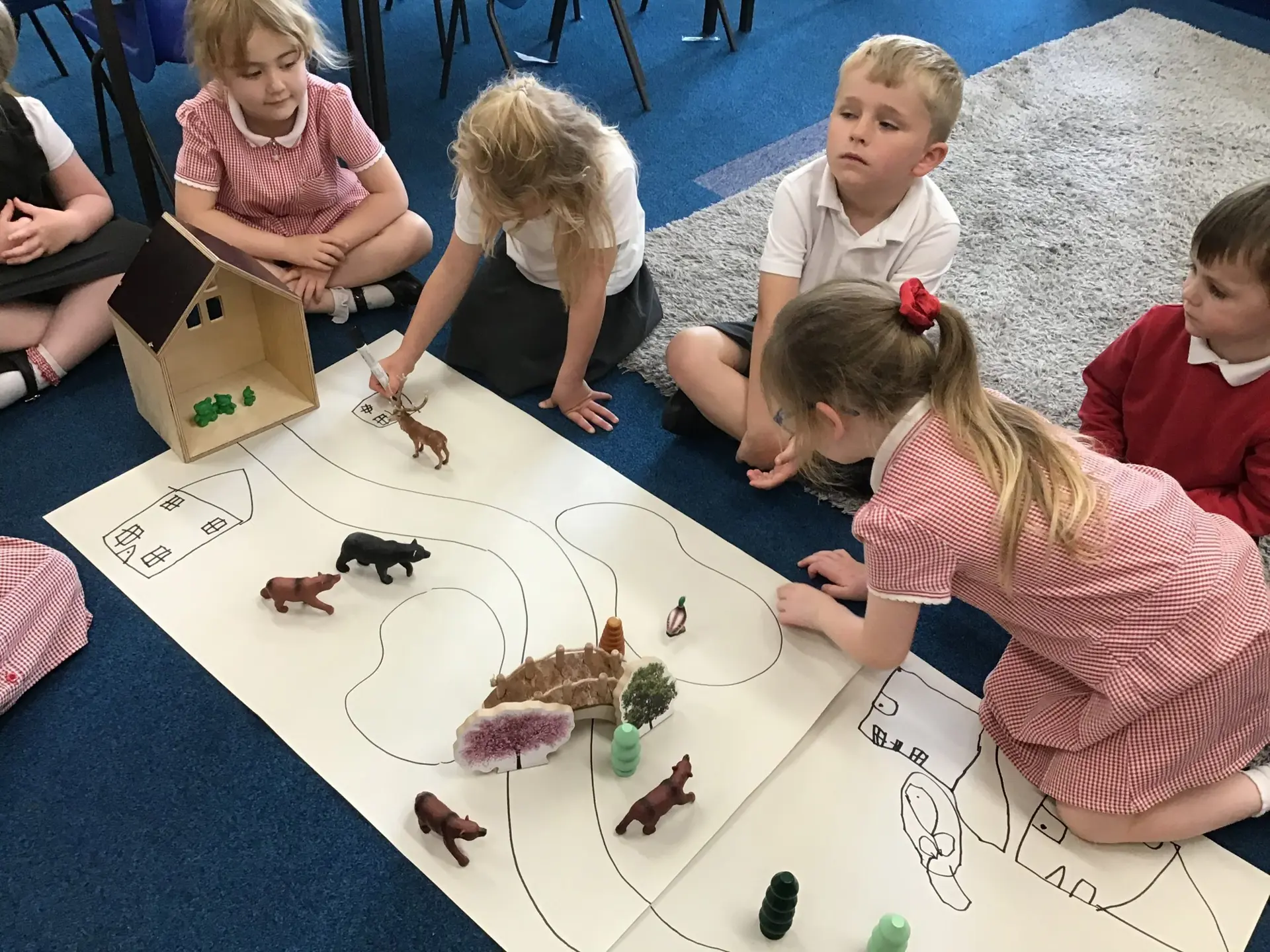 A group of children designing a farm.