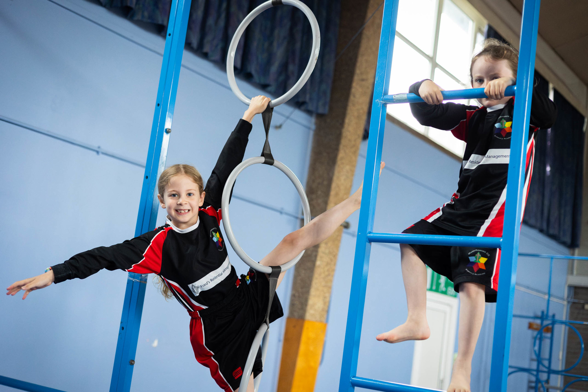 Child balancing with a gymnastics ring.
