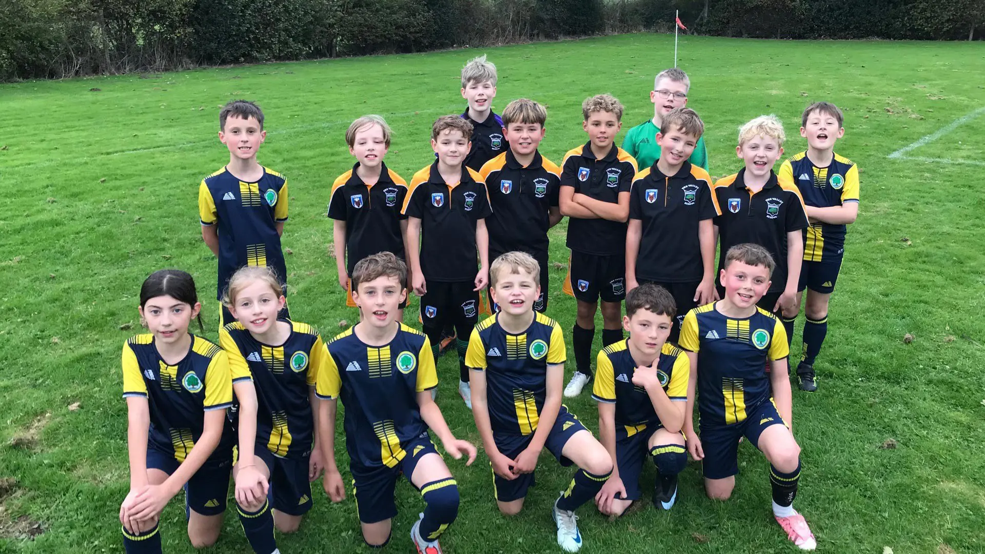 Three TMPF Trust schools smiling together after a football match.