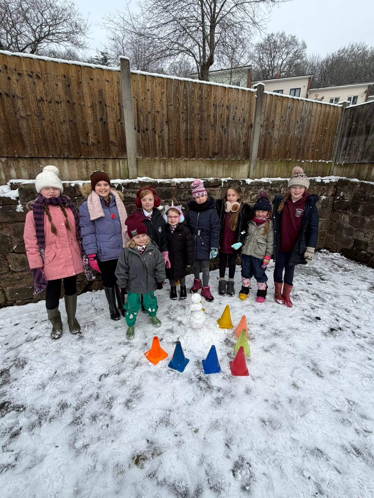 Children building a snowman.