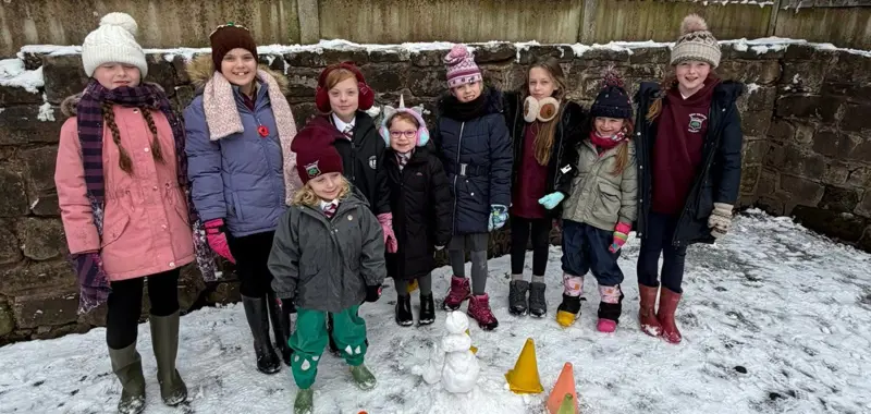 Children building a snowman.