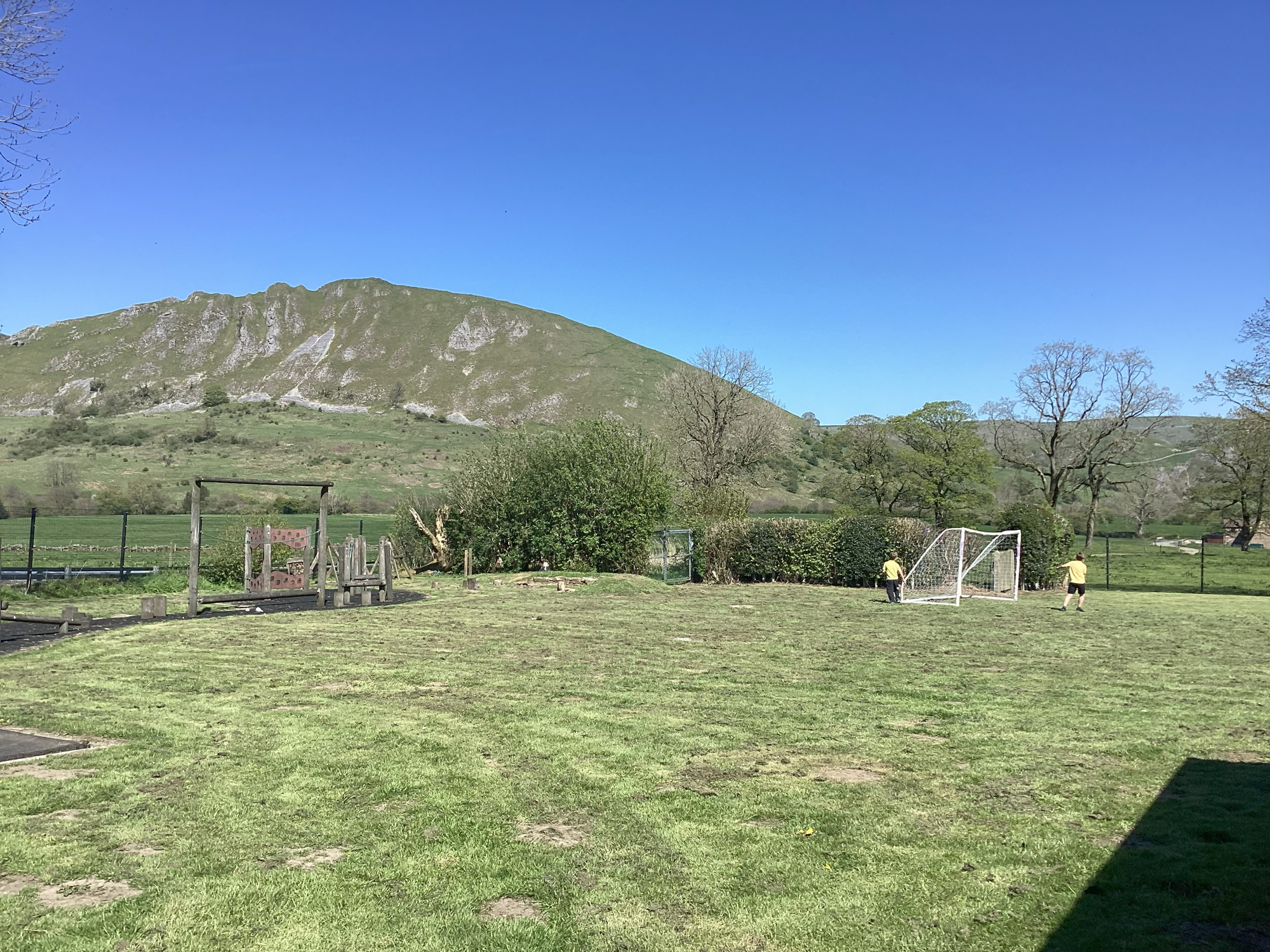 School field with hill in the background