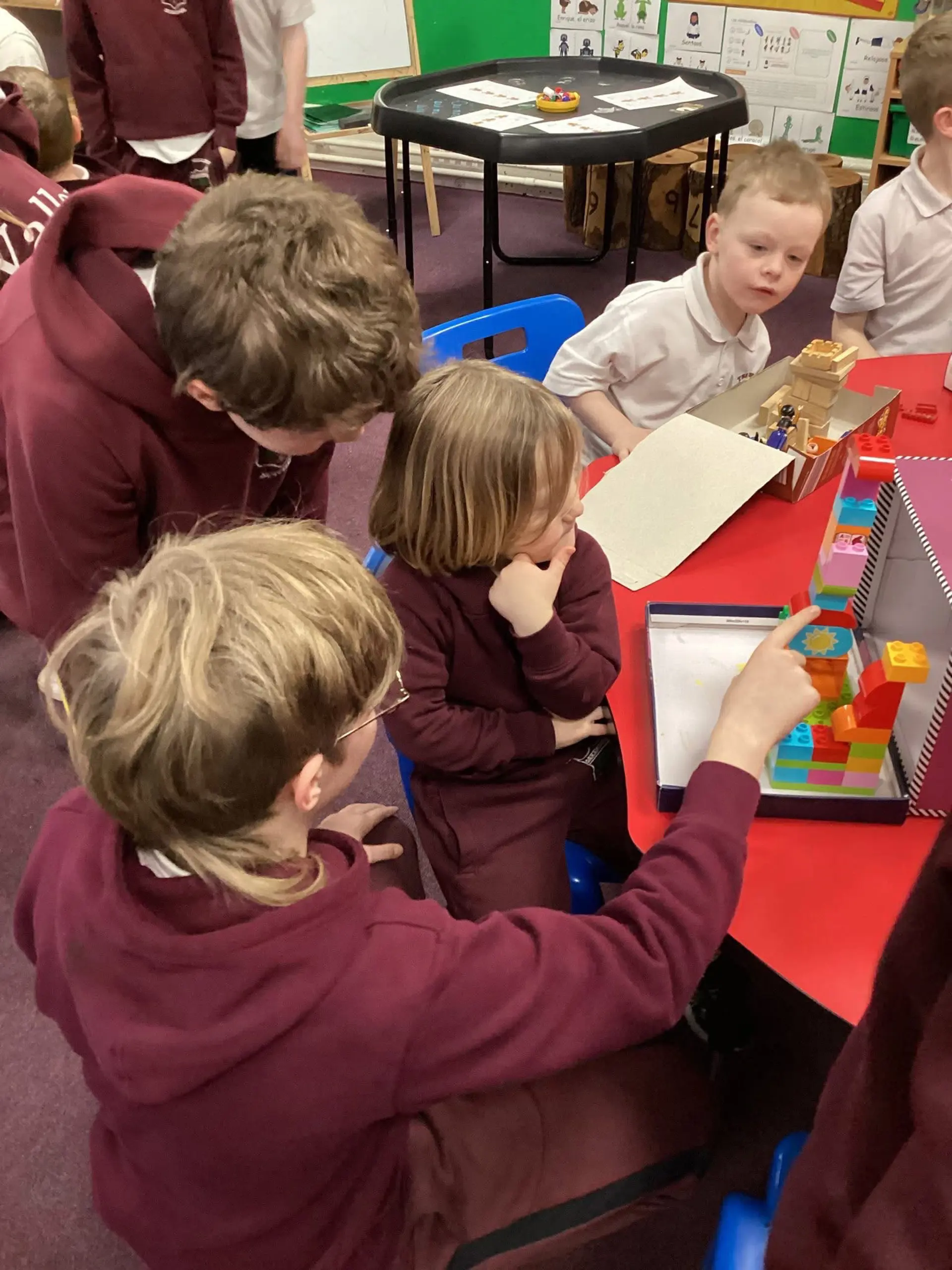 Older children and younger children learning together.