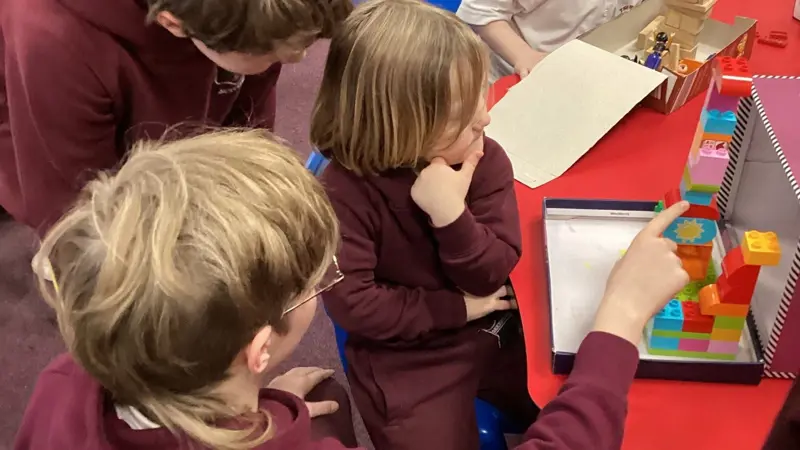 Older children and younger children learning together.