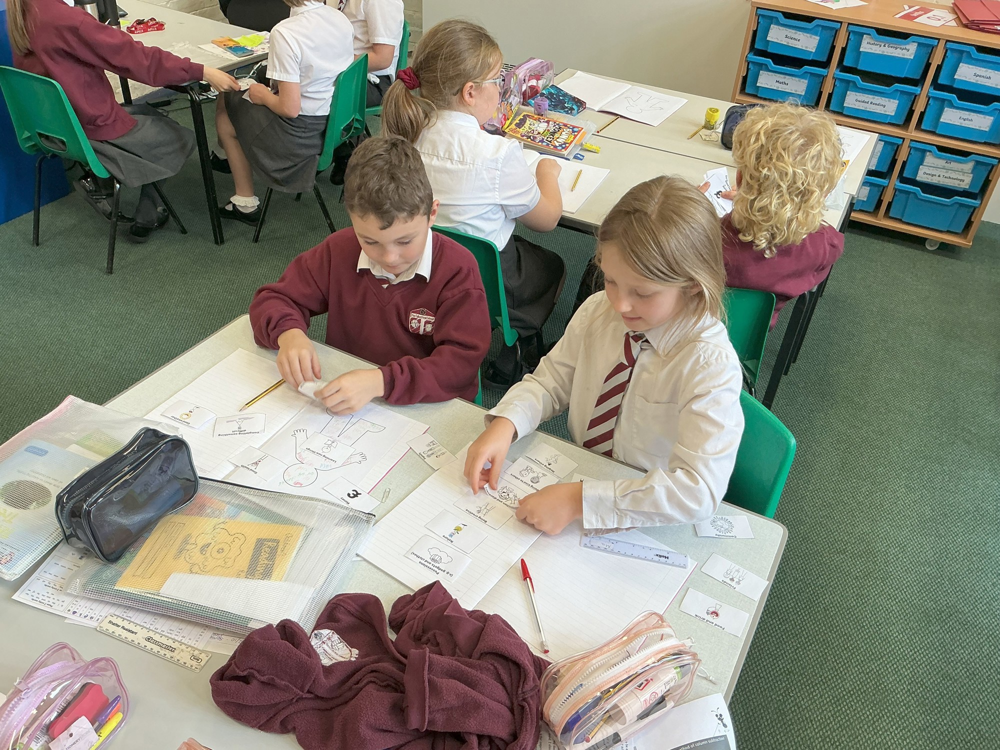 Children learning at a desk.