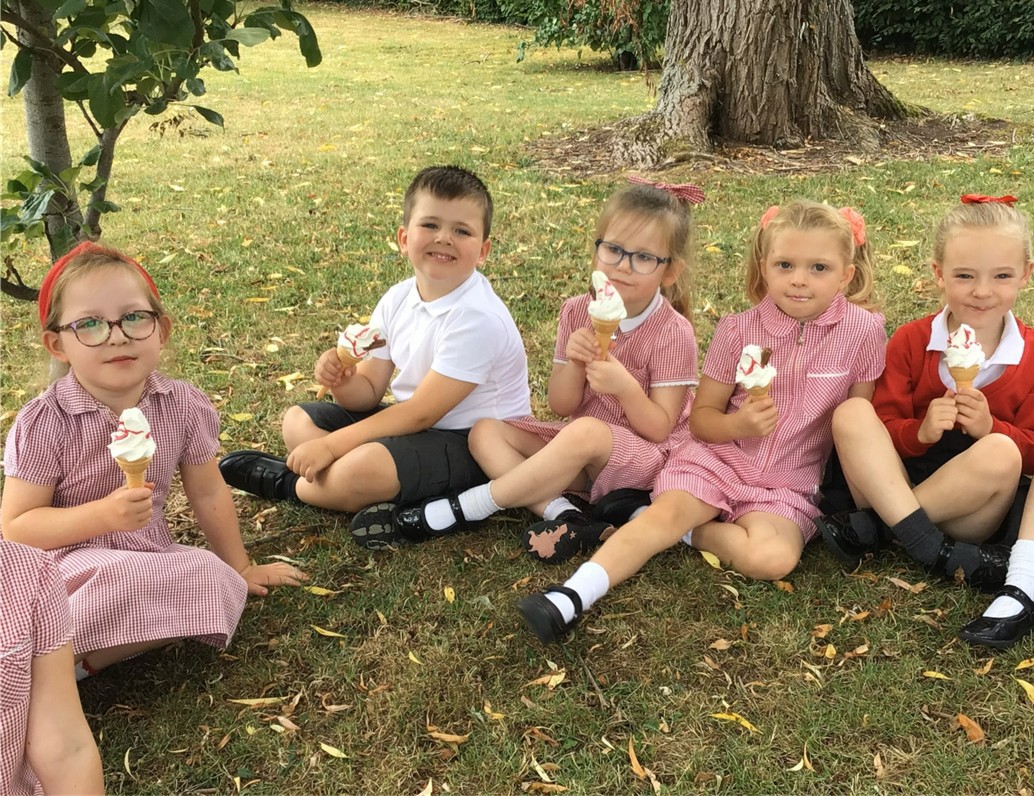 Children smiling and eating ice cream