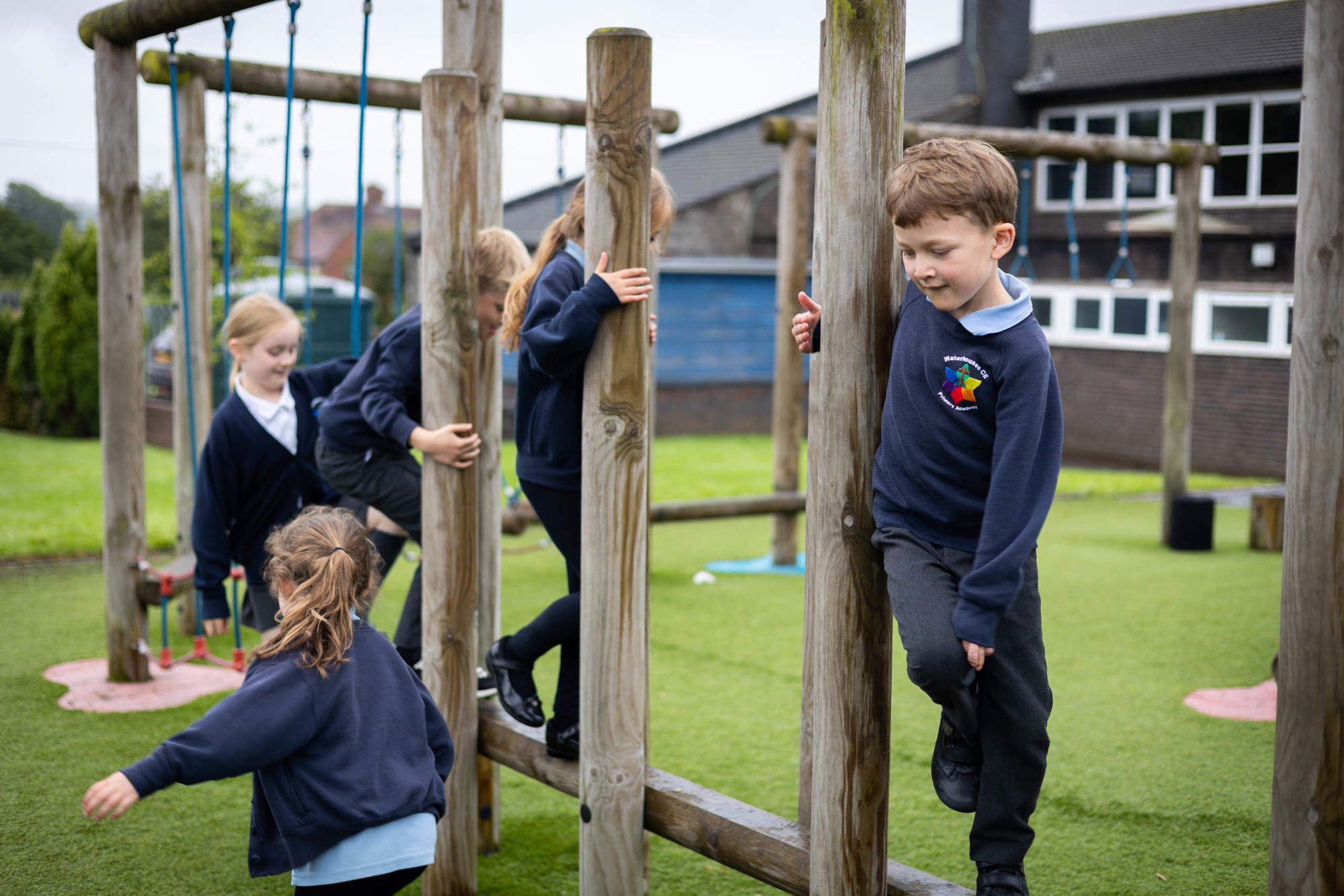Children playing on outdoor equipment.
