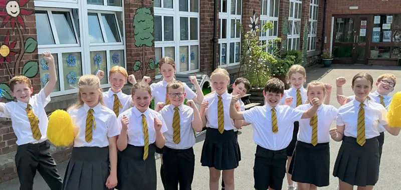 Group of children celebrating school's success