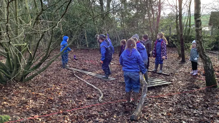 Children learning during a forest school session.