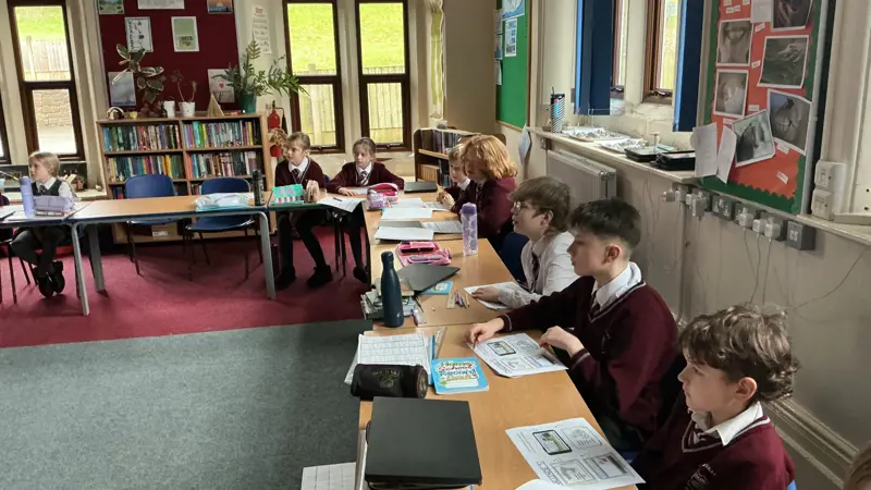 Children learning together in class