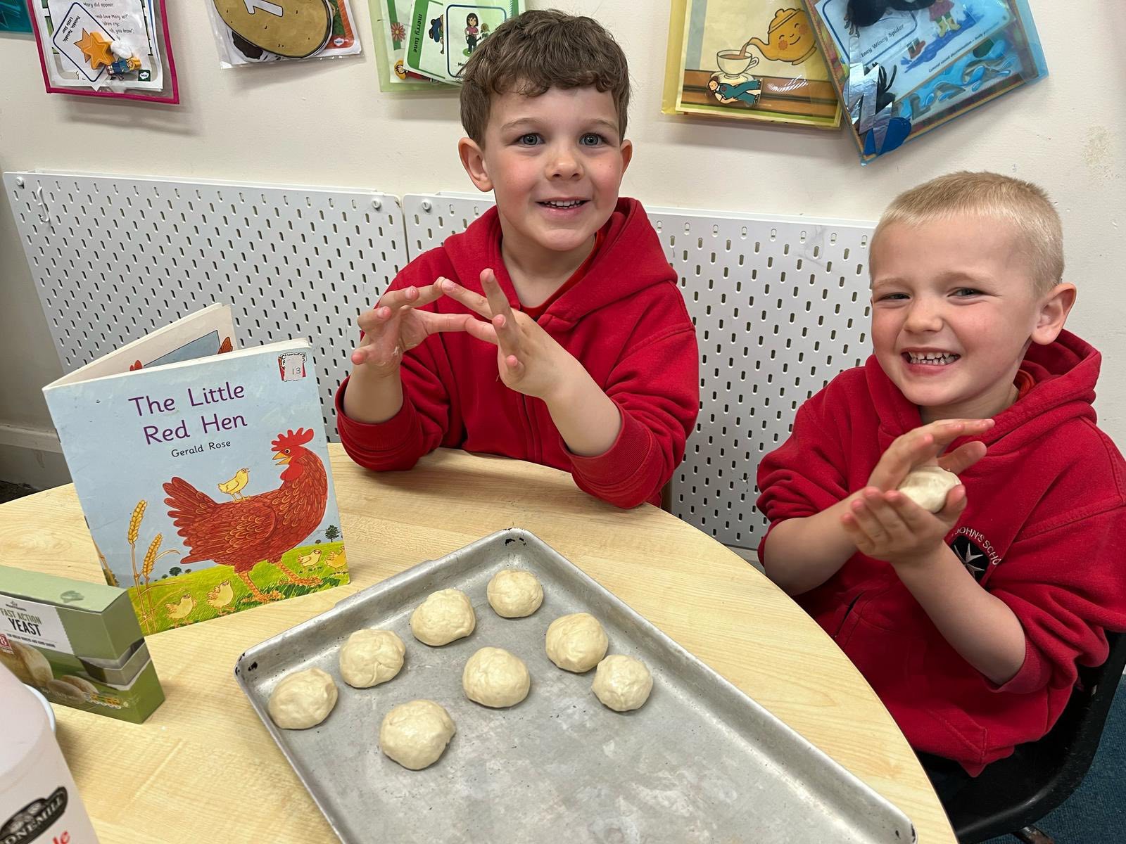 Two children preparing dough to bake.
