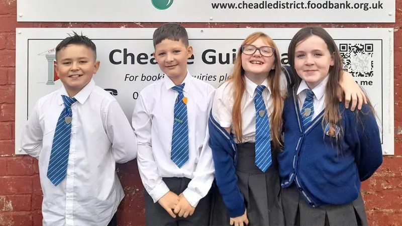 Four children from Dilhorne Endowed CE Primary School at the local Foodbank.